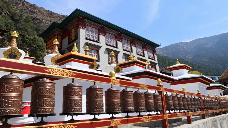 Thupten Choling Monastery with prayer wheels in the foreground